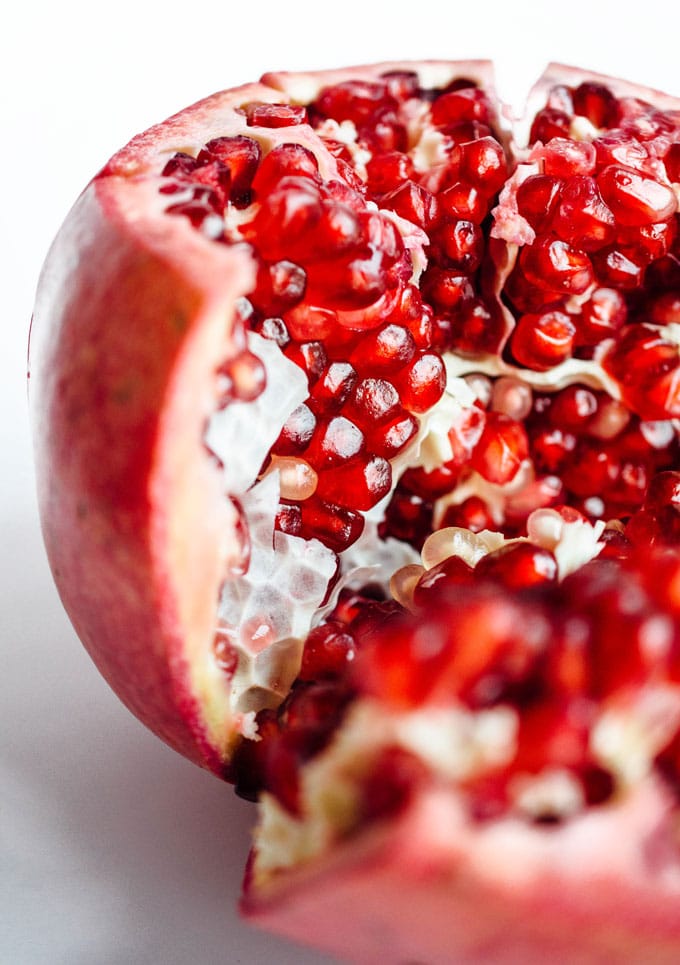 Close up photo of a pomegranate on a white background
