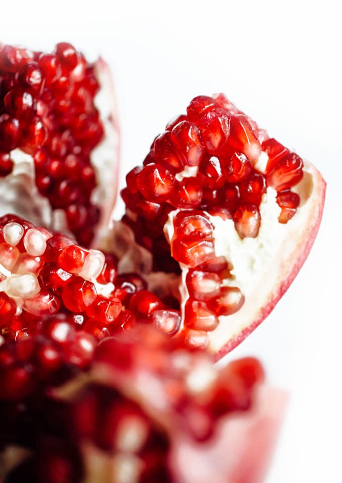 Close up photo of a pomegranate on a white background