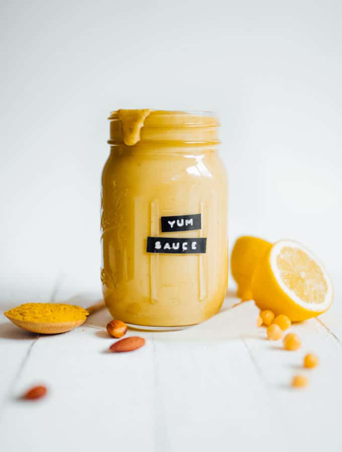 A mason jar filled with yum sauce and labeled as so