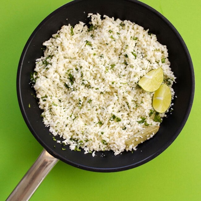 This Chipotle Copycat Cauliflower Rice packs all the signature lime and cilantro flavors of your favorite Chipotle rice (but in low carb cauliflower rice form!)