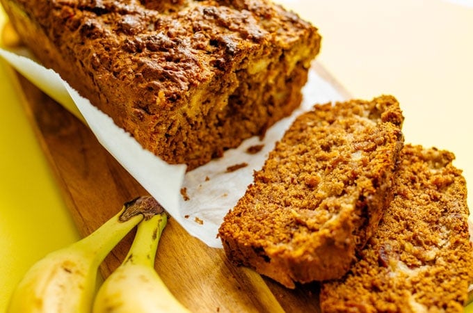 This Vegan Banana Bread is loaded with dates, almond butter, and a plant-based cream cheese filling that makes it ultra-moist!