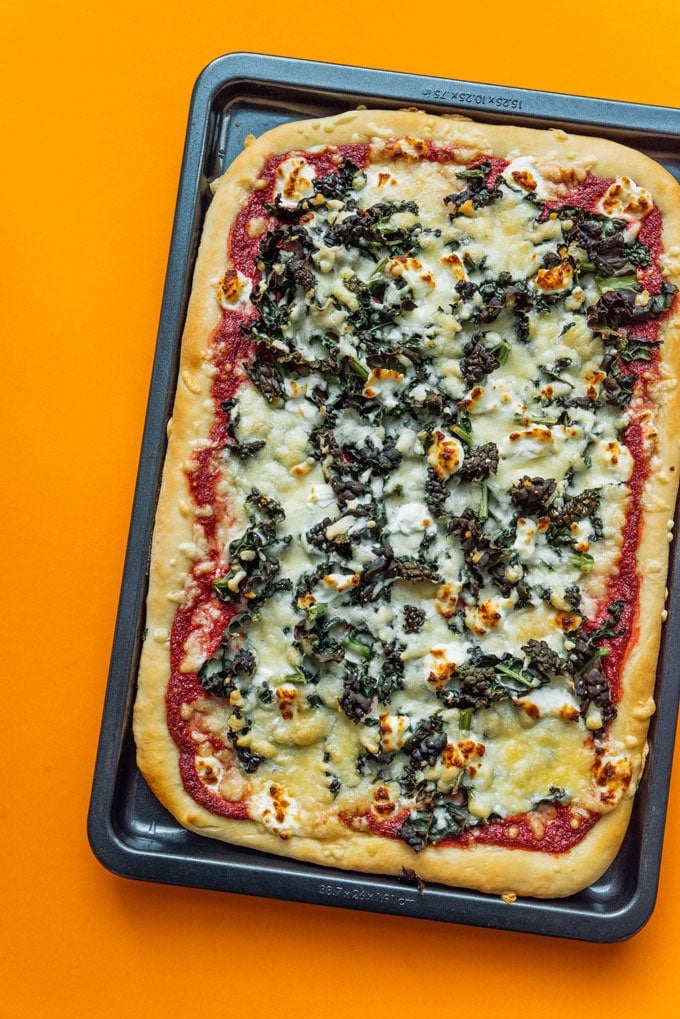 Step up your pizza game with this Beet Pesto Pizza with Goat Cheese and Kale, a decadent, healthy pizza that's packed with flavor and antioxidants.