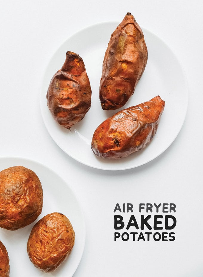 Air fryer sweet potatoes on a white background - The ultimate guide on how to cook air fryer potatoes! How to make roasted potatoes, homemade French fries, and potato chips in your air fryer, using both white potatoes and sweet potatoes.