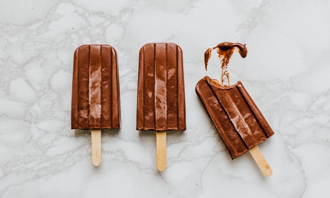 Popsicles on white background - With innovative and undeniably refreshing recipes for the whole family, For The Love OF Popsicles cookbook is your one-stop-shop for modern, unique pops from A to Z.