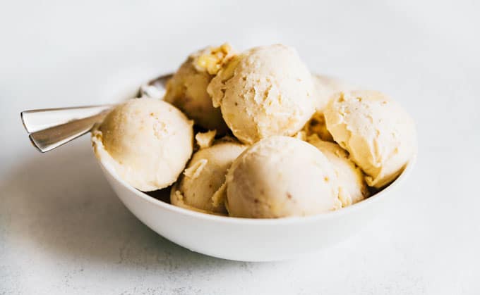 Banana nice cream recipe in a white bowl - Satisfy your sweet tooth with this creamy and customizable 1-ingredient Banana Nice Cream!