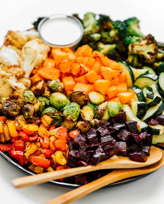 Roasted vegetables on a white background - Your ultimate guide to air fryer vegetables! How to air fry virtually any vegetable into perfectly cooked, healthy deliciousness.