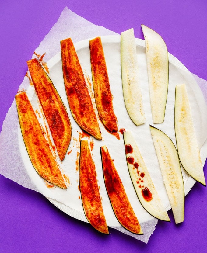 Vegan eggplant bacon recipe on purple background - This vegan Eggplant Bacon recipe takes all the flavor and crispiness of bacon and packs it into thinly sliced bacon!