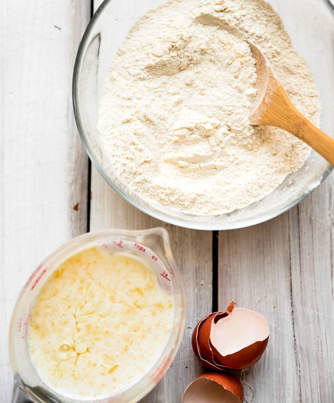 Ingredients to make the best buttermilk pancakes recipes in a bowl on a white background.