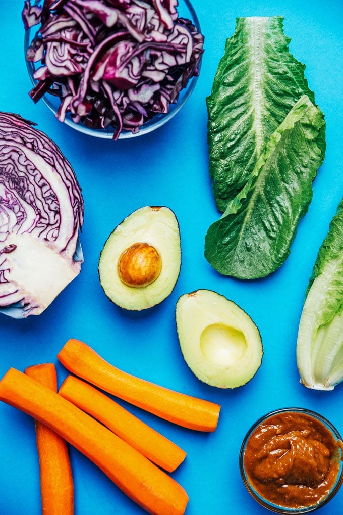 Fresh veggie lettuce wraps ingredients on a blue background