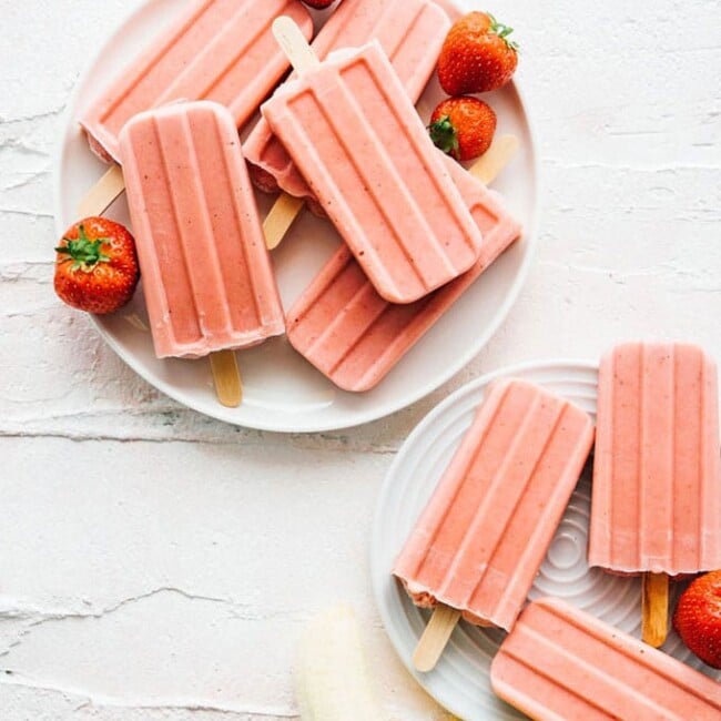 Banana strawberry popsicles recipe on a white plate