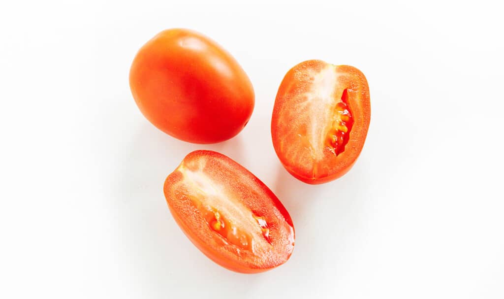 Roma tomatoes on a white background
