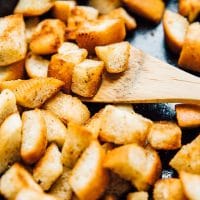Making homemade croutons in a cast iron skillet