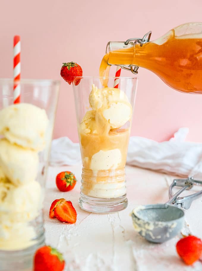 Pouring strawberry kombucha into ice cream float