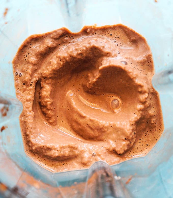 Tofu mocha frappuccino in a blender with blue background