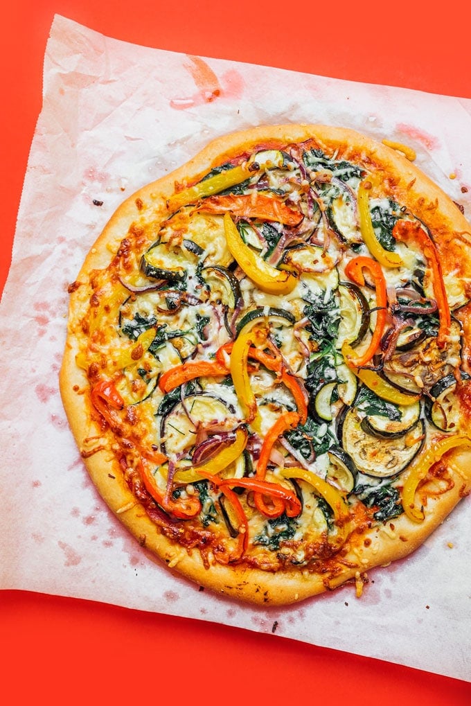 Vegetable pizza on parchment paper