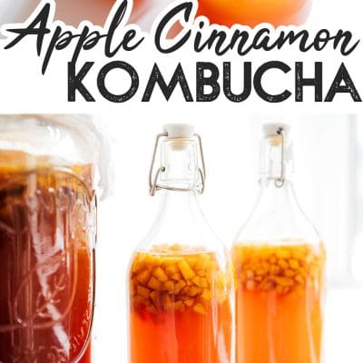 Apple cinnamon kombucha into a glass with a white background