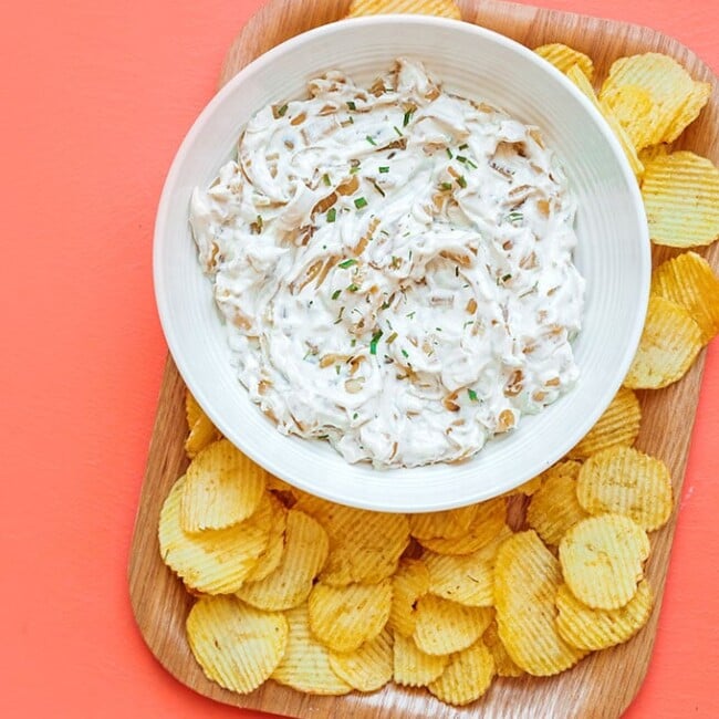 Healthy French onion dip in a bowl with potato chips