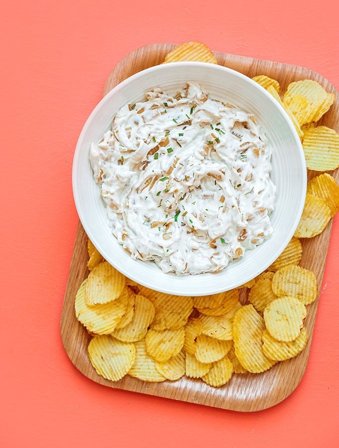 Healthy French onion dip in a bowl with potato chips
