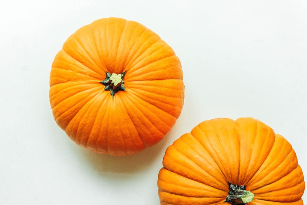 Two traditional pumpkins on a white background
