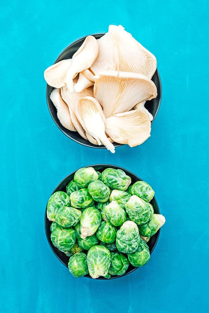 Oyster mushrooms and Brussels sprouts in bowls