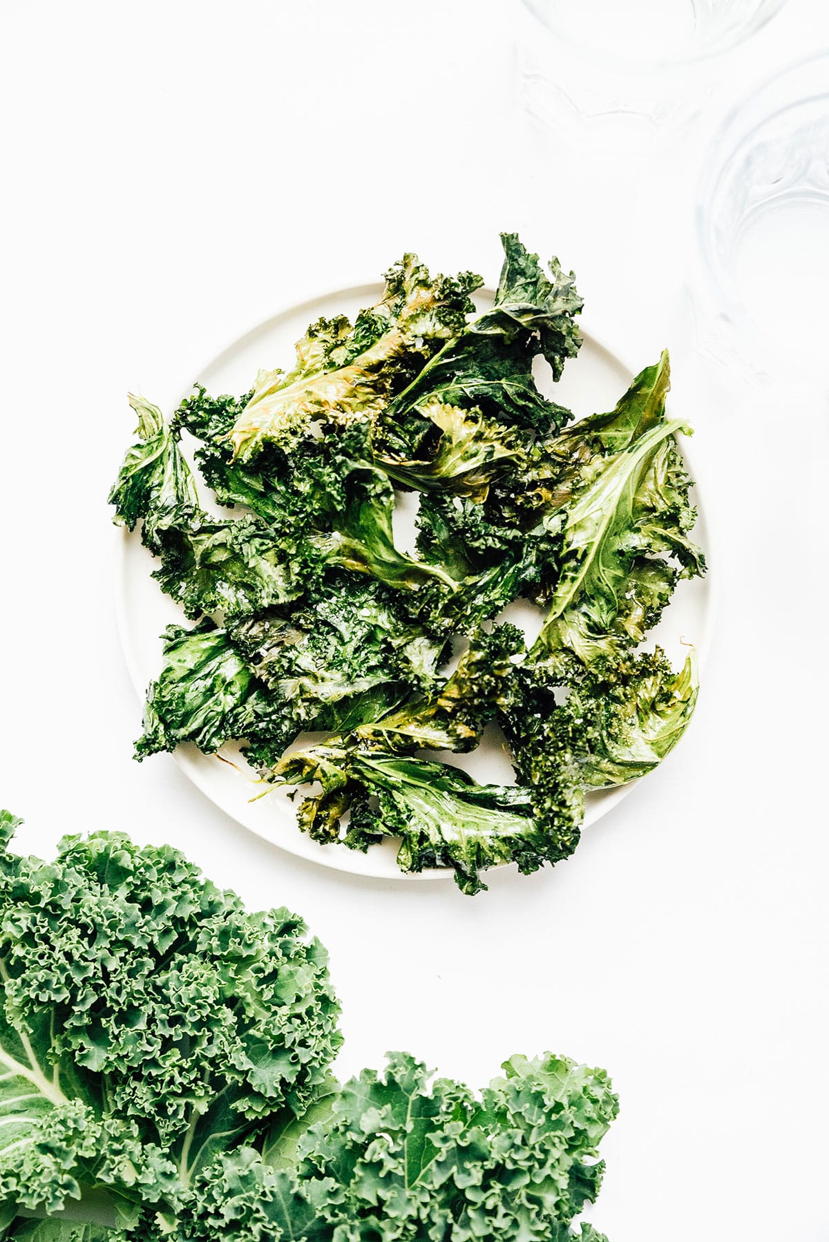 Kale chips on a white plate.