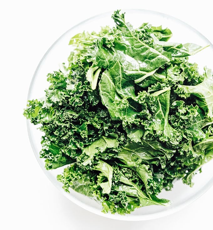 Kale in a bowl on a white background