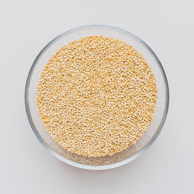 Quinoa in a bowl on a white background