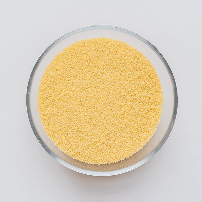 Couscous in a bowl on a white background
