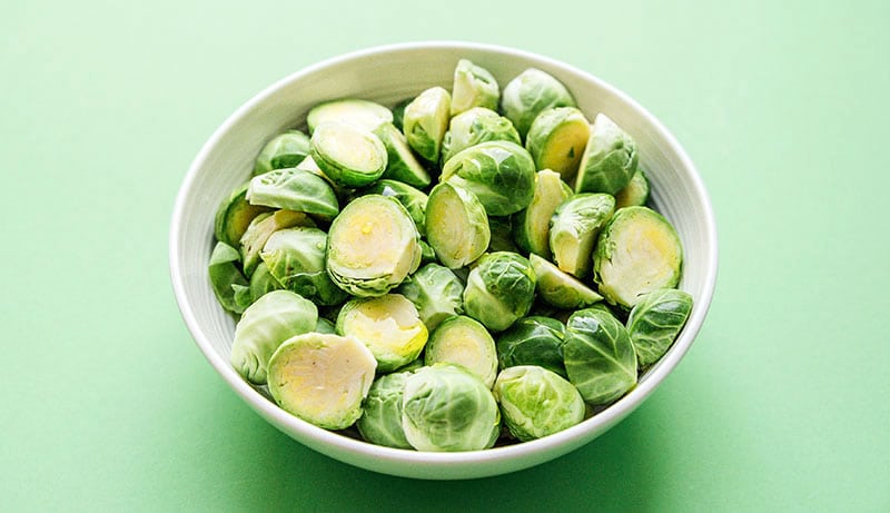 Raw Brussels sprouts in a bowl