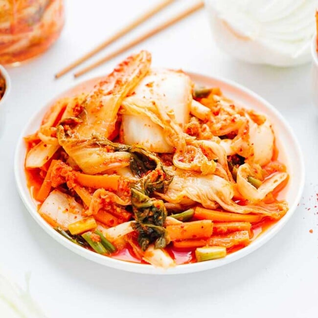 Kimchi on a plate with white background