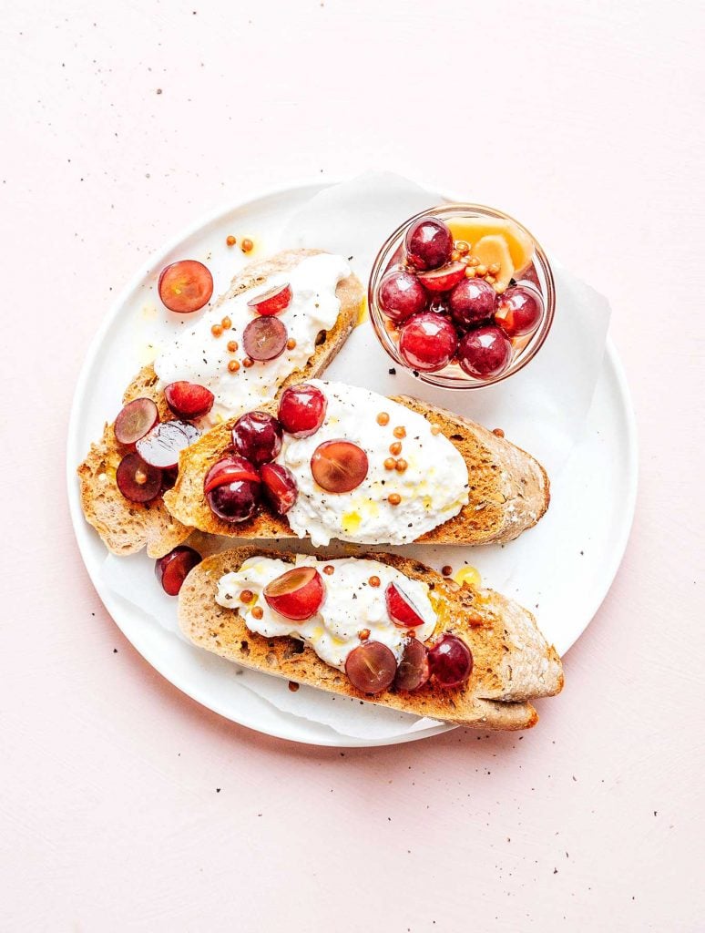 Pickled grapes on burrata and toast