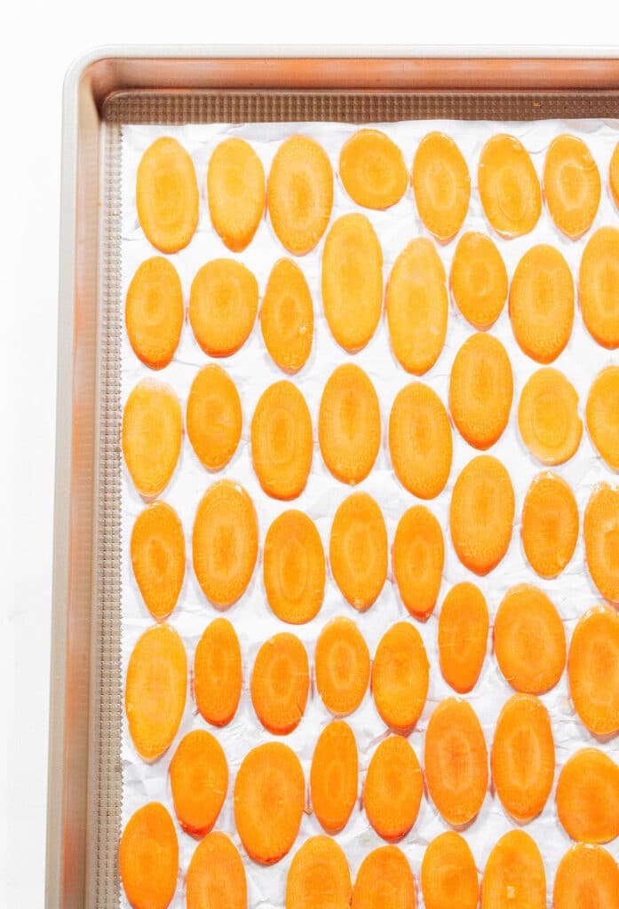 Carrot chips on a baking sheet.