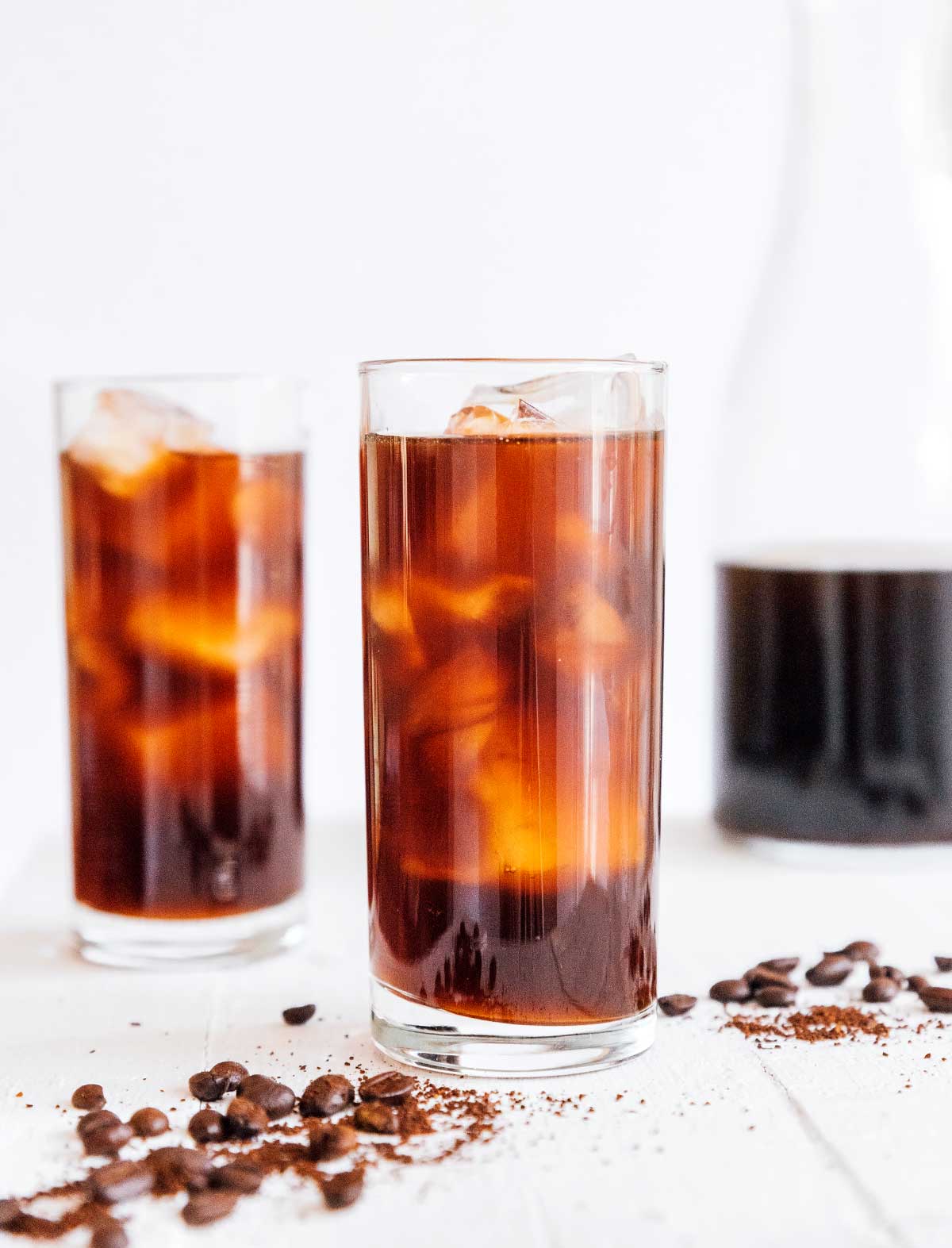 Two tall glasses of iced cold brew coffee