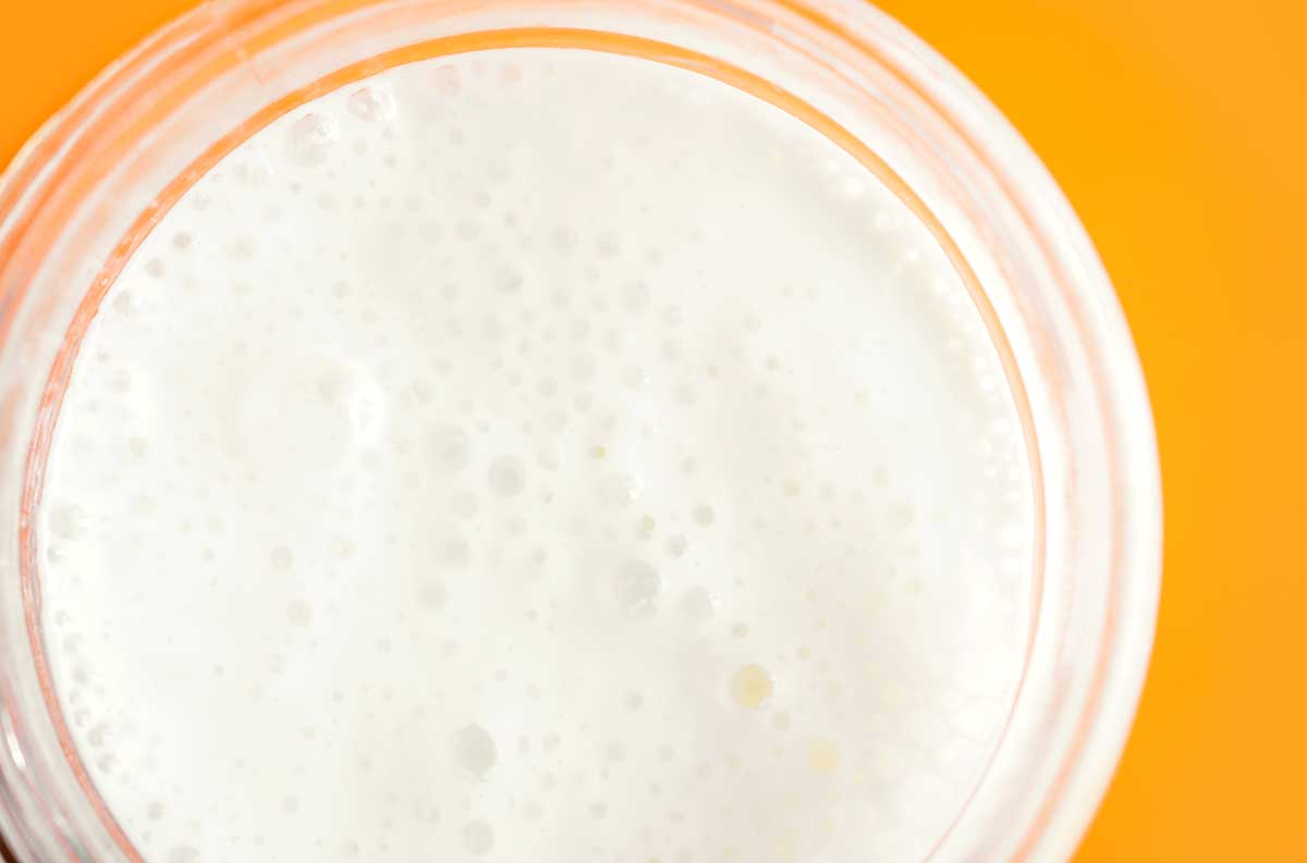 Closeup photo of bubbly milk kefir