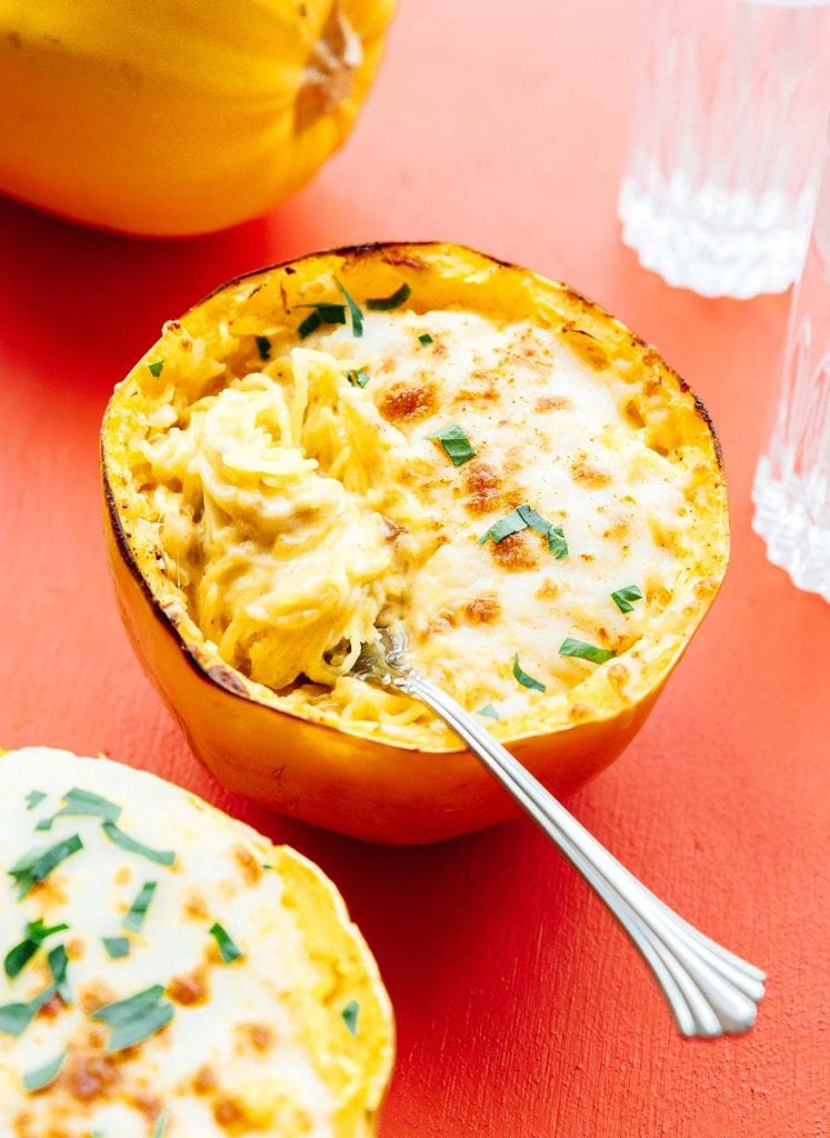 A roasted and broiled squash filled with spaghetti squash mac and cheese