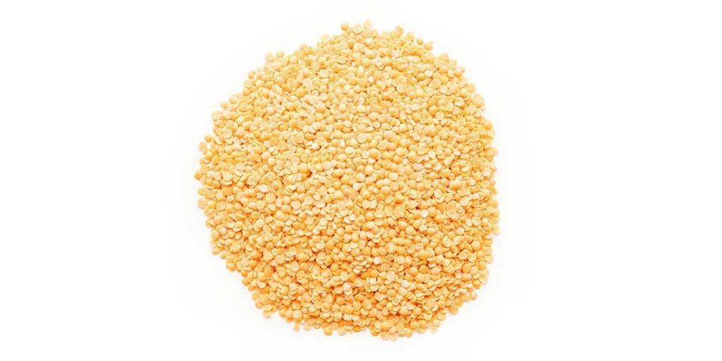 Dried lentils on a white background