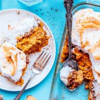 Sweet potato casserole with meringue on a blue background