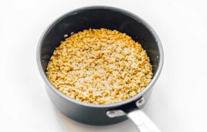 A saucepan filled with yellow lentils and white rice, viewed from above, offers a comforting, hearty meal. For an exciting twist on grains, you might explore how to cook freekeh for a nutty alternative to pair with your creations.