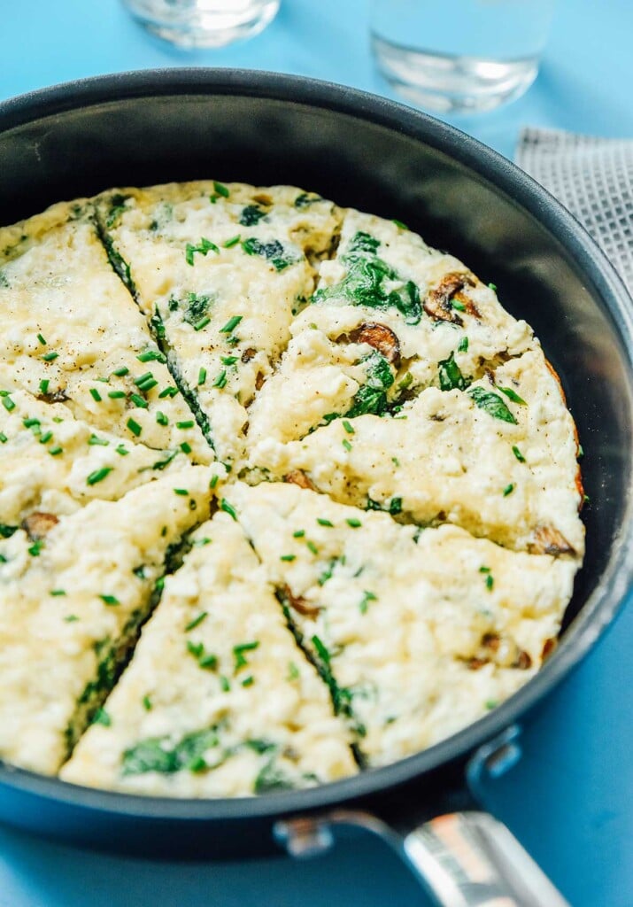 A skillet filled with an egg white frittata cut into 8 slices 