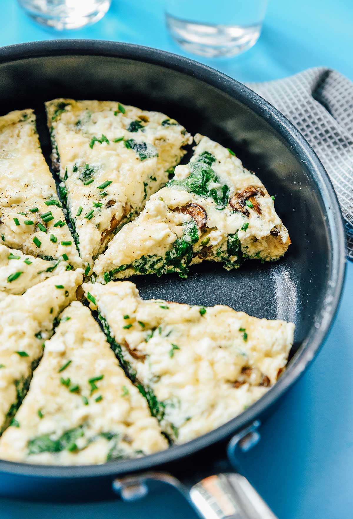 A skillet filled with 7 slices of egg white frittata 