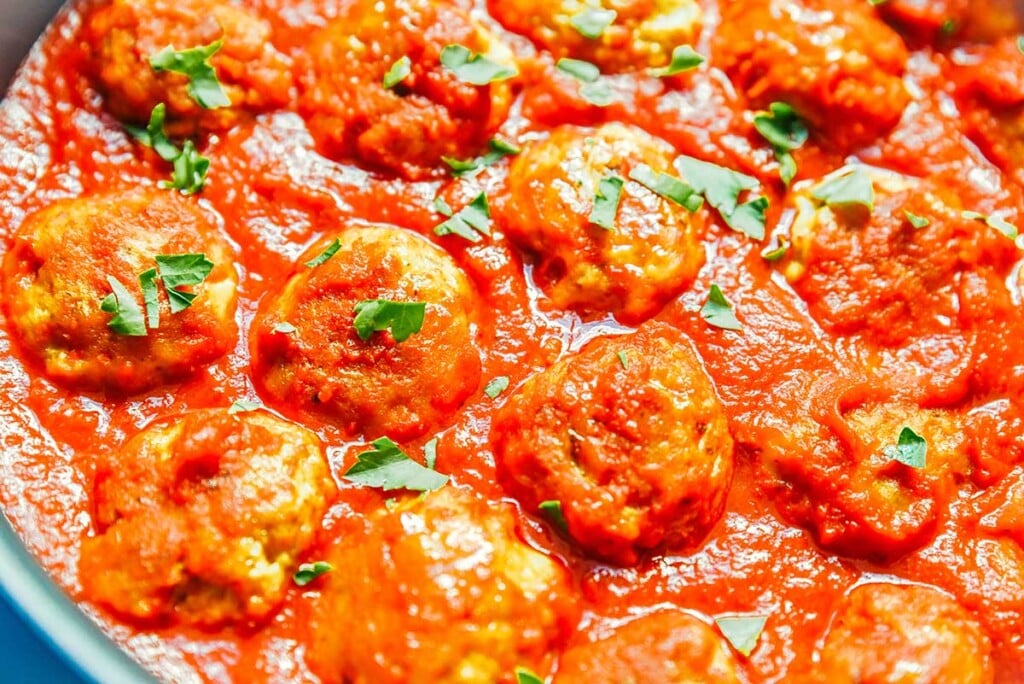 A close-up image of seitan meatballs showing the texture and detail of the cooked dish