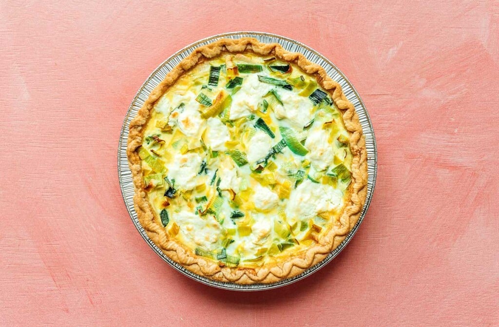 A freshly cooked goat cheese and leek quiche