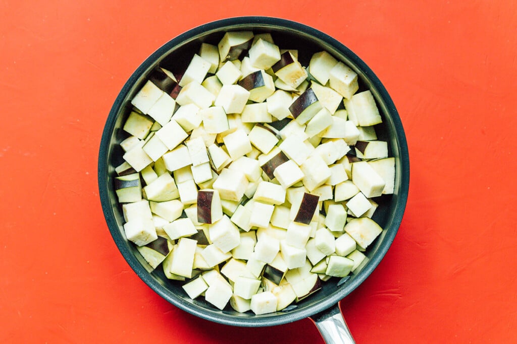 Cubed eggplant in a pan.