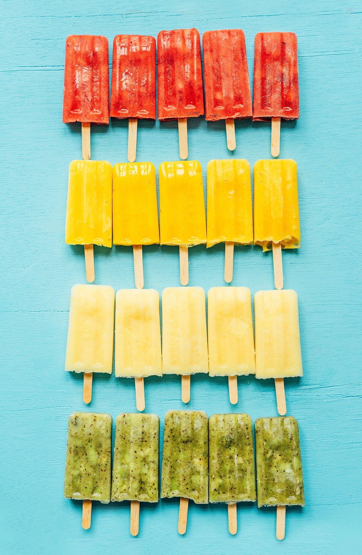 Multicolored Mexican paletas on a blue background