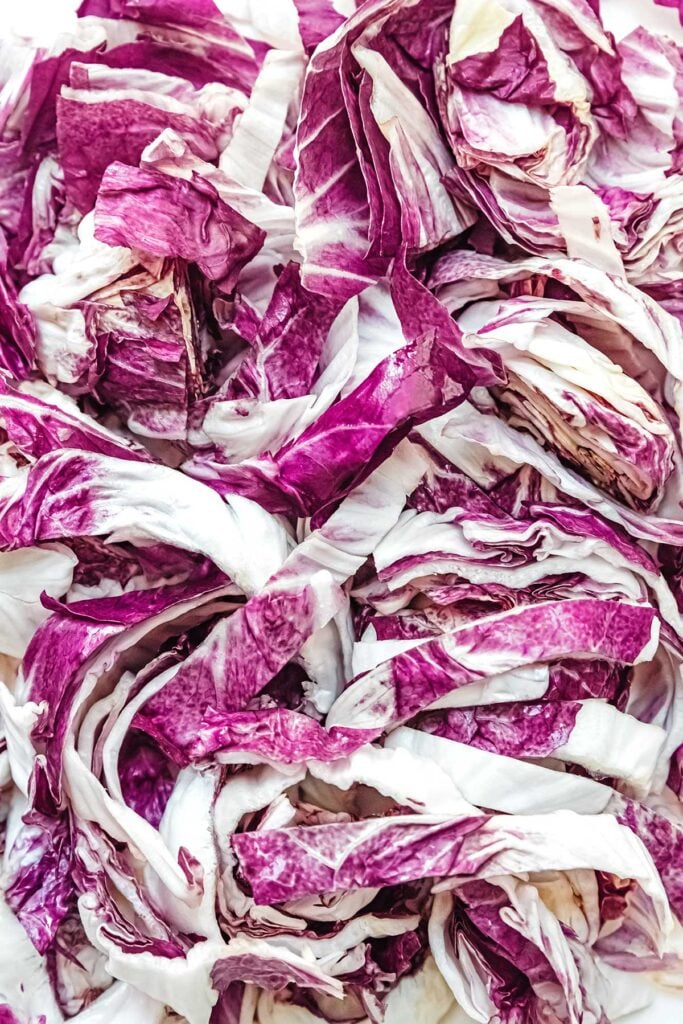 An up-close view detailing the texture and color of sliced radicchio lettuce