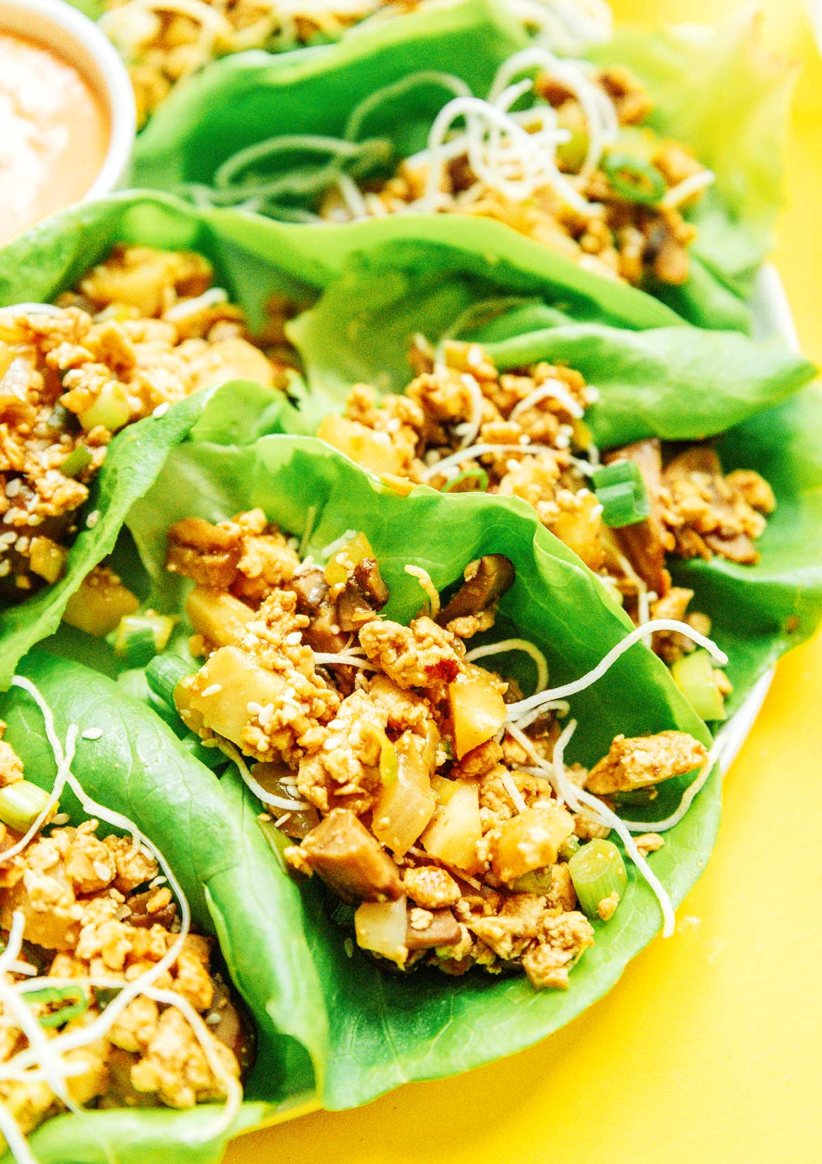 A close-up view detailing the filling in vegan lettuce wraps