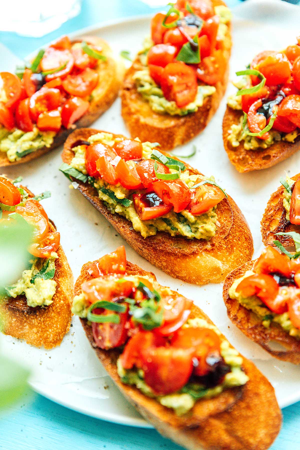 A close up view detailing the texture of avocado bruschetta