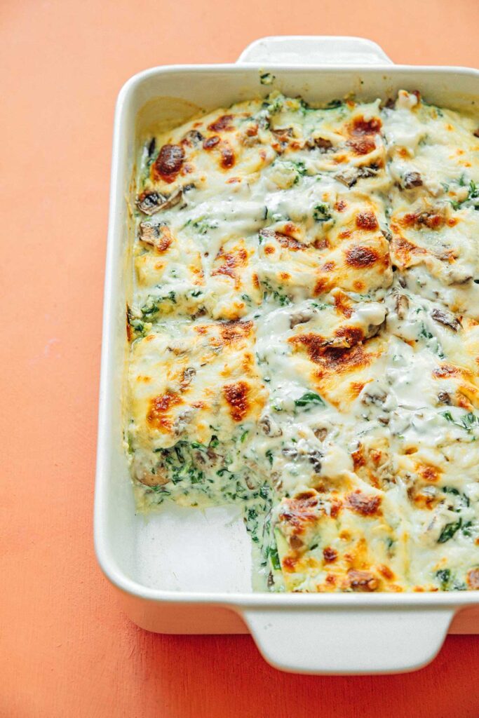 A 9x13 casserole dish filled with freshly baked zucchini lasagna