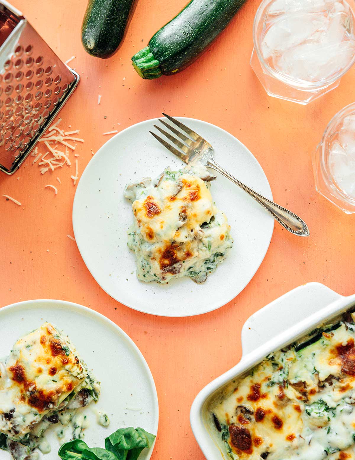 A white plate filled with a serving of vegetarian zucchini lasagna