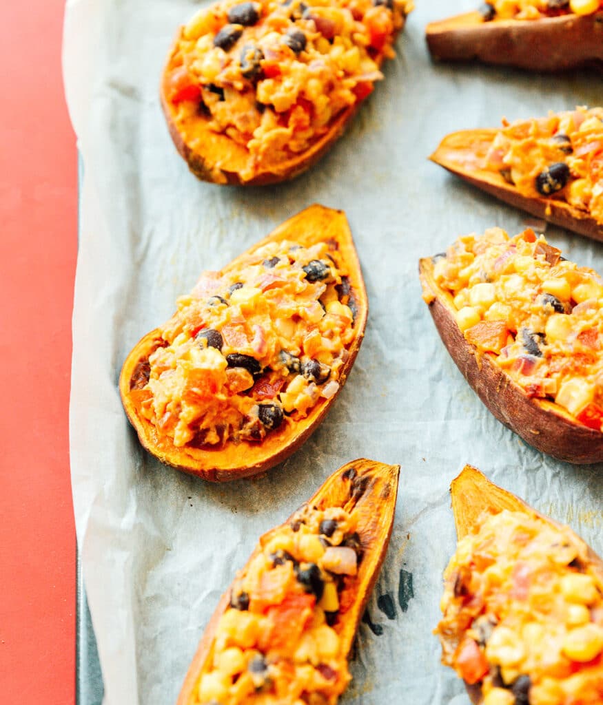 7 Mexican sweet potato skins placed neatly on a baking sheet
